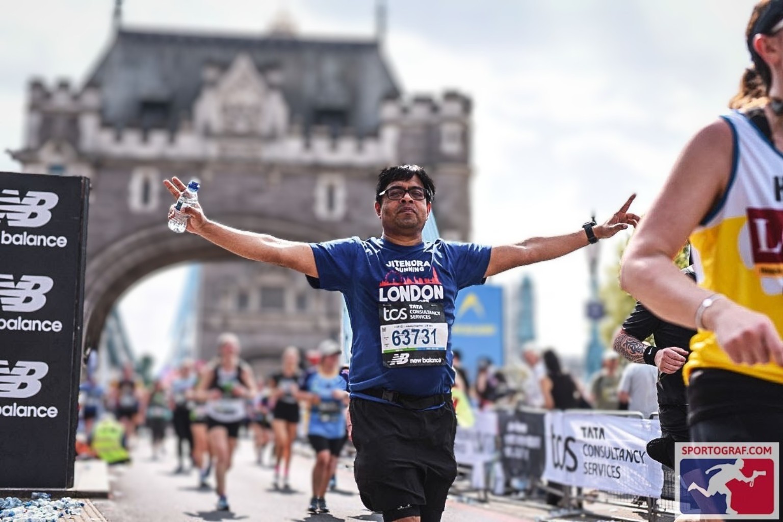 Jitendra celebrating during the London Marathon near Tower Bridge