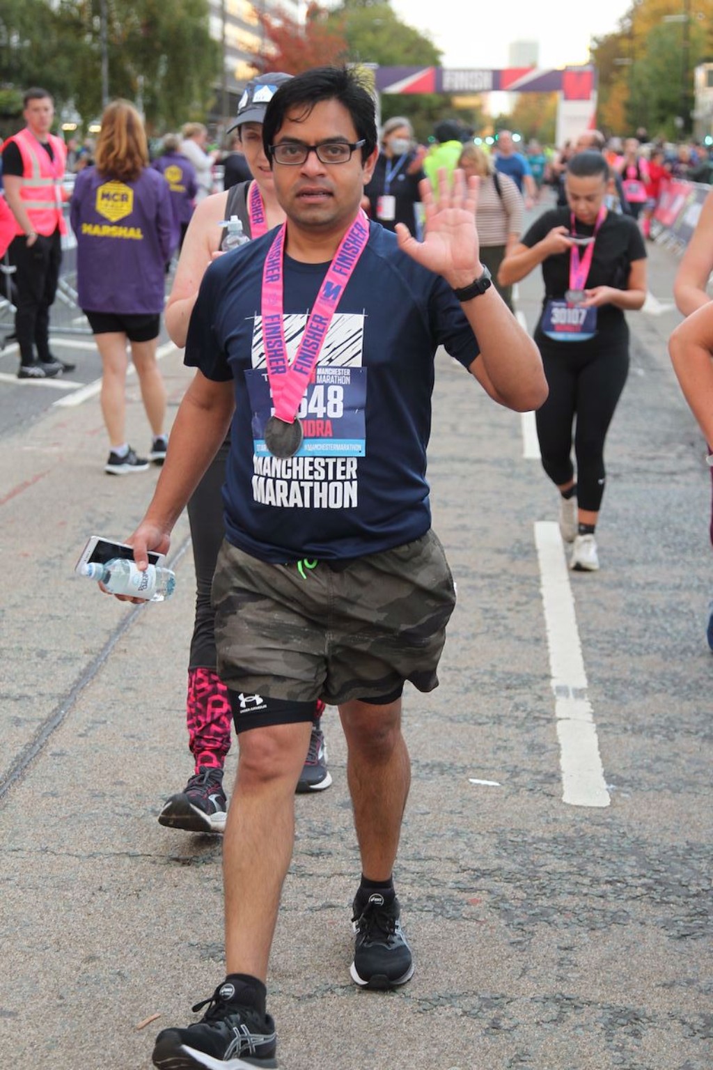 Jitendra waving after the Manchester Marathon